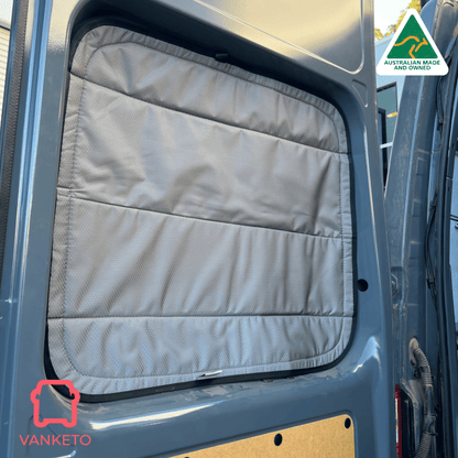 A light gray padded fabric window shade installed on a vehicle side window, shown in a real vehicle environment with a Vanketo logo in the corner and an Australian Made and Vanketo badge.